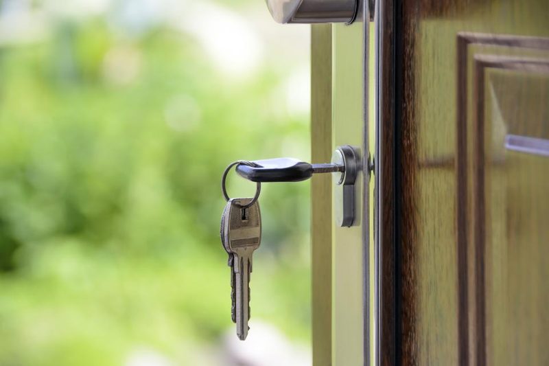 House keys hanging from a door lock