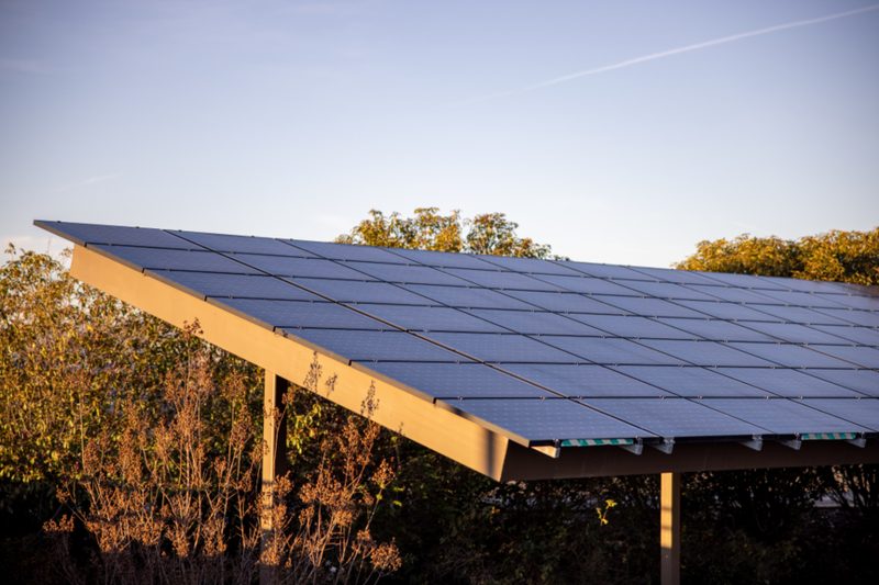 Rooftop solar panel array under a clear sky